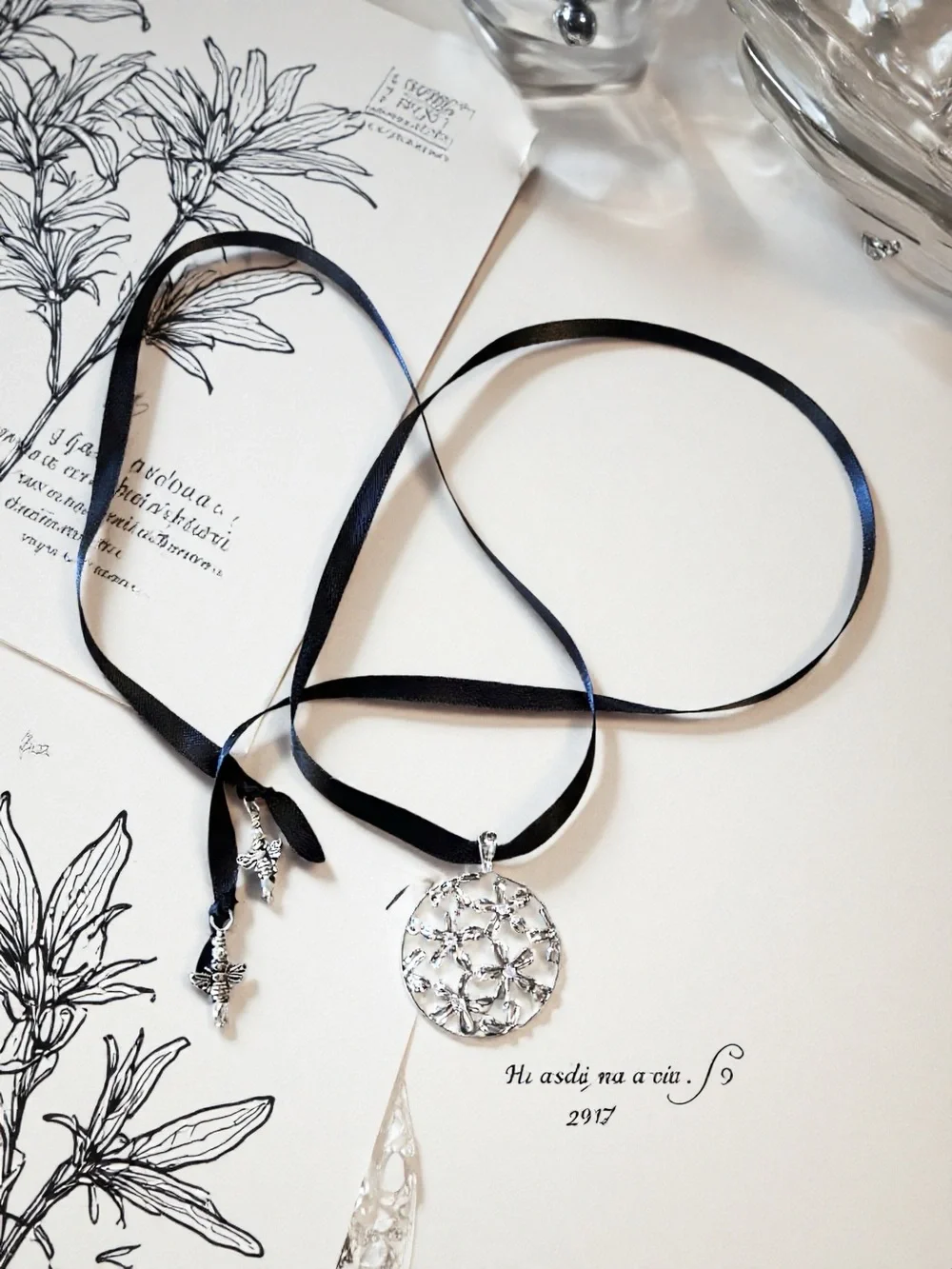Silver Toned Floral Cutout Pendant Necklace on Black Satin Ribbon
